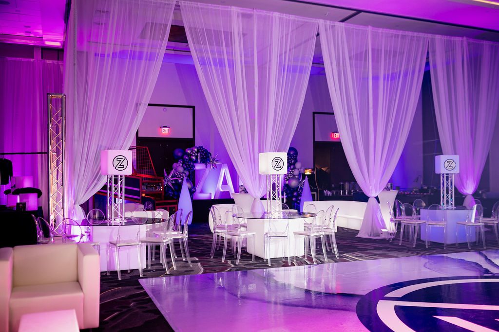 Draped lounge and monogram planned by Kingsley Event Consulting